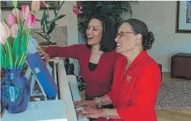  ?? | SUN- TIMES LIBRARY ?? Hattie Burton ( right), shown with daughter Cheryl Burton, the ABC7 news anchor, often played piano for her students.