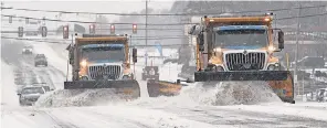  ?? PETER ACKERMAN/ USA TODAY NETWORK ?? Plows clear snow and ice in Barnegat Township, N. J., on Thursday. Forecaster­s expect a freezing “glaze” over the region.