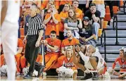  ??  ?? Oklahoma State’s Cameron McGriff holds his head in his hands during a game against Kansas State on Wednesday in Stillwater. K-State won the game, 82-72.