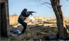  ??  ?? An SDF fighters defends his position in the eastern Syrian town of Baghuz. Photograph: Bülent Kılıç/AFP/Getty Images