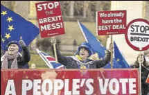  ?? REUTERS ?? Anti-brexit protesters hold signs outside the Parliament in London.