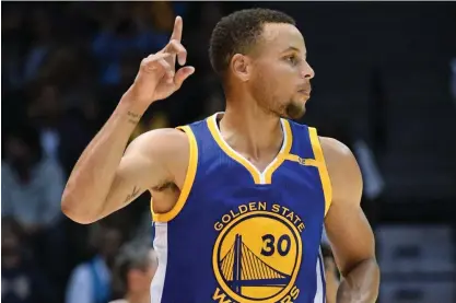  ?? ASSOCIATED PRESS ?? Golden State Warriors guard Stephen Curry gestures after hitting a 3-pointer during the second half of an NBA preseason basketball game against the Los Angeles Lakers in San Diego.