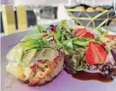  ?? ?? The crabcake, served alongside a small salad, is topped with remoulade.