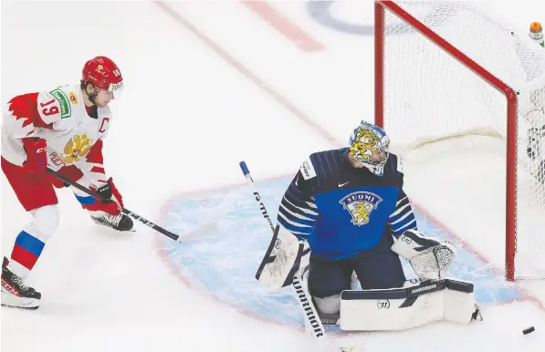  ?? — GETTY IMAGES FILES ?? Vasili Podkolzin of Russia, a Canucks prospect, takes a shot against goaltender Kari Piiroinen of Finland during the 2021 IIHF World Junior bronze medal game in Edmonton. A 2019 first-rounder, Podkolzin is currently playing with Russia's CSKA.