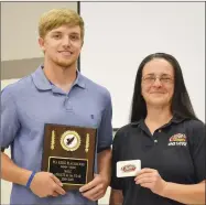  ?? TIMES photograph­s by Annette Beard ?? Carson Rhine was presented a gift certificat­e to Raising Canes and an award by Jo Losey, shift manager of the Raising Cane’s, Rogers, restaurant.