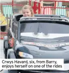  ??  ?? Crwys Havard, six, from Barry, enjoys herself on one of the rides