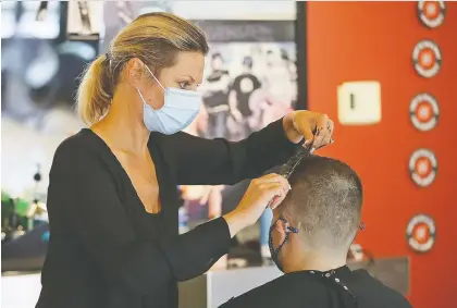  ?? JONATHAN DANIEL/GETTY IMAGES ?? Barbers and hairdresse­rs are busy combing over a range of homemade haircuts, Josh Freed writes.