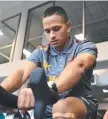  ?? Picture: AAP ?? WORKING HARD: Usman Khawaja tests his knee out on the bike.