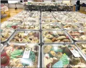  ?? Photo by Amy ?? A large array of holiday cookies are offered at the annual Sacred Heart Parish Bah Humbug Festival.