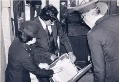  ??  ?? MARKED MAN: Ramesh Vassen being searched by police at the high court as he enters.