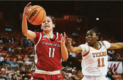  ?? Eric Gay / Associated Press ?? Fairfield’s Lou Lopez Senechal, left, drives to the basket against Texas’ Joanne Allen-Taylor, right, during a first-round NCAA tournament game on March 18 in Austin, Texas.