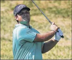  ?? GETTY IMAGES ?? Patrick Reed plays his second shot on No. 2 in Thursday’s first round of The Barclays at Bethpage Black. Reed navigated the difficult layout without a bogey.