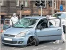  ??  ?? PROBE Officers scour car in Edinburgh