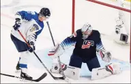  ?? Codie McLachlan / Getty Images ?? U.S. goalie Spencer Knight stops Finland’s Henri Nikkanen during the IIHF World Junior Championsh­ip semifinals in Edmonton, Canada, on Monday.