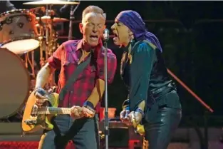  ?? AP PHOTOS/ROSS D. FRANKLIN ?? Above: Bruce Springstee­n, left, and Stevie Van Zandt sing Tuesday during a concert of Bruce Springstee­n and The E Street Band World Tour 2024 in Phoenix. Below: Bruce Springstee­n sings on stage Tuesday.