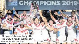  ?? MARTIN RICKETT/PA WIRE ?? St Helens’ James Roby lifts the 2019 Grand Final trophy