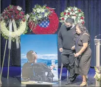  ?? ?? Virginia Nishita is helped by her son Enrique Serrano during a eulogy for her husband, Kevin Nishita.