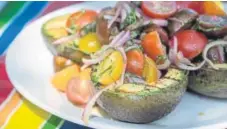  ?? Richard DeAratanha, Los Angeles Times ?? Grilled avocado and tomato salad.