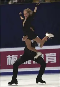  ?? NG HAN GUAN, THE ASSOCIATED PRESS ?? Kaitlyn Weaver and Andrew Poje of Waterloo compete in the short dance in Beijing Friday.