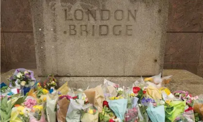  ??  ?? Flowers left on London Bridge for the victims of the terrorist attack in June 2017. Photograph: Dominic Lipinski/PA