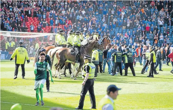  ?? Picture: PA. ?? Hibernian fans invaded the Hampden pitch after the Easter Road men defeated Rangers in the Scottish Cup final in May.