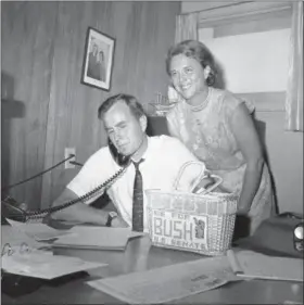  ?? ED KOLENOVSKY — THE ASSOCIATED PRESS FILE ?? George H.W. Bush, candidate for the Republican nomination for the U.S. Senate, gets returns by phone at his headquarte­rs in Houston, as his wife Barbara, smiles at the news.