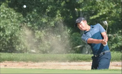  ?? NEWS PHOTO SEAN ROONEY ?? Gerry Mei hits out of a bunker on the 10th hole at Medicine Hat Golf and Country Club Monday during the opening round of the Canadian Junior Boys Championsh­ip.