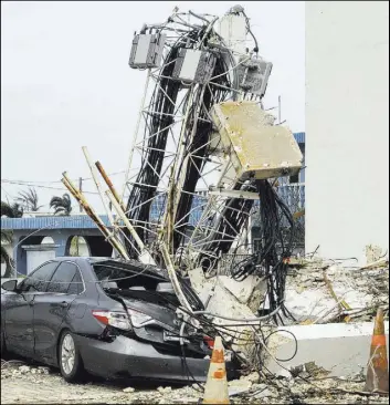  ?? The Associated Press ?? A photo taken by Edwin Propst shows destructio­n Thursday on the island of Saipan after Super Typhoon Yutu swept through the Northern Marianas.