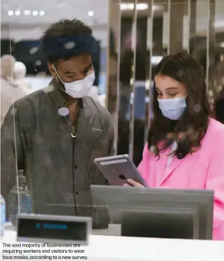  ??  ?? The vast majority of businesses are requiring workers and visitors to wear face masks, according to a new survey.