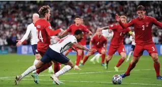  ??  ?? Raheem Sterling is fouled by Denmark’s Mathias Jensen for the penalty which was awarded to England in the first half of extratime at Wembley last night