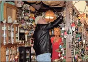  ?? Diane Wagner / RN-T ?? Steve Reynolds (left) of Armuchee talks with Christa Grant, owner of Christa’s, Etc., about architectu­ral details in her shop.