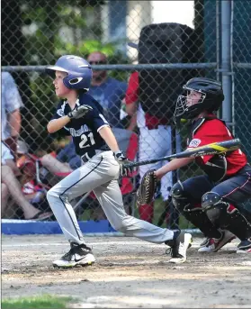  ?? Photos by Ernest A. Brown ?? Cumberland National 11-year-old all-star pitcher Matt Maher (top left) throws a pitch, while Owen Koczera (21) singles in the second inning of National’s 2-1 win over CALL at Garvin Field Saturday.