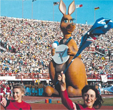  ?? Picture: NATIONAL ARCHIVES OF AUSTRALIA ?? Iconic 1982 Commonweal­th Games mascot Matilda makes her entry to QEII Stadium during the opening ceremony and (below) Aboriginal leader Warren Mundine protests on the streets of Brisbane.