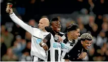  ?? PHOTO: REUTERS ?? Newcastle United players celebrate clinching promotion to the English Premier League.