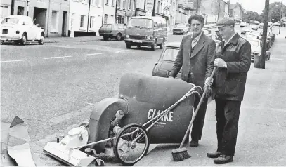  ?? (Pic: Stritch/ Bartley Collection) ?? How times have changed! Mick Cuffe and Johnny Carroll sweeping the streets in Fermoy back in 1980.