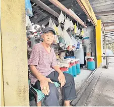  ?? ?? Mohammad runs a sundry shop at Kampung Semarang.