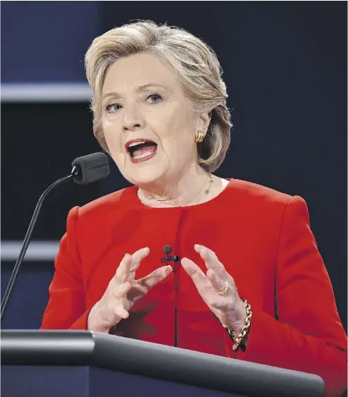  ?? PAUL J. RICHARDS / AFP / GETTY IMAGES ?? Hillary Clinton risks driving traditiona­l Republican­s back into Donald Trump’s camp when she emphasizes policy.