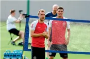  ?? — AFP ?? Denmark’s Christian Eriksen and defender Andreas Christense­n attend a training session.