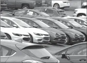 ?? Gene J. Puskar/AP ?? Autos: Chevrolet cars sit on the lot of a dealer in Pittsburgh. On Monday, automakers release monthly sales reports.