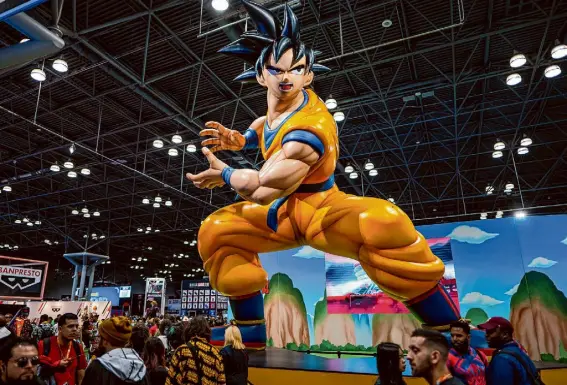  ?? Charles Sykes/Associated Press ?? A Dragon Ball Z booth stands out at New York Comic Con in October. Akira Toriyama, the creator of one of Japan’s best-selling series, influenced Japanese comics since the early 1980s.