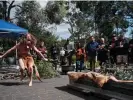  ?? Photograph: Peter Whyte/The Guardian ?? A ceremony marking the return of ancient Indigenous rock carvings to Tasmania’s west coast after they were cut and removed for museum display more than 60 years ago at the Tasmanian Museum and Art Gallery collection­s and research facility in Hobart