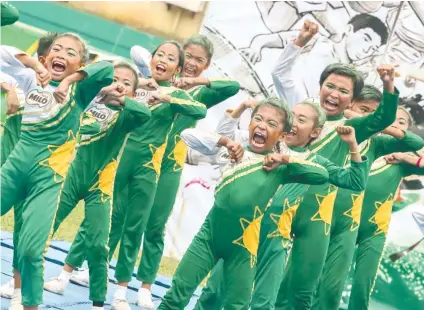  ?? SUNSTAR FOTO / ALEX BADAYOS ?? FACES OF A CHAMPION. Members of the Cebu City Central School opened the Milo Little Olympics with a gold in cheerdanci­ng.