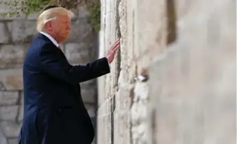  ?? MANDEL NGAN/AFP/GETTY IMAGES ?? Donald Trump became the first sitting U.S. president to visit the Western Wall in Jerusalem’s Old City on Monday.