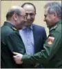  ?? VADIM SAVITSKY — RUSSIAN DEFENSE MINISTRY PRESS SERVICE POOL PHOTO VIA AP, FILE ?? Russian Defense Minister Sergei Shoigu, right, and Iranian Defense Minister Gen. Hossein Dehghan shake hands during their meeting in Moscow, Russia.