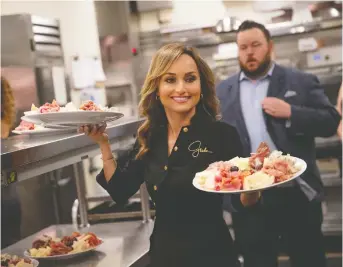  ?? ERIK KABIK/KABIK PHOTO GROUP ?? Giada De Laurentiis serves up plates of antipasti during the Las Vegas festival.