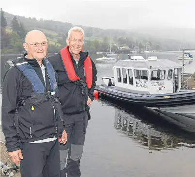  ?? Picture: Gareth Jennings. ?? Norman Brett and owner Donald Riddell, right, at the boat on Loch Tay.