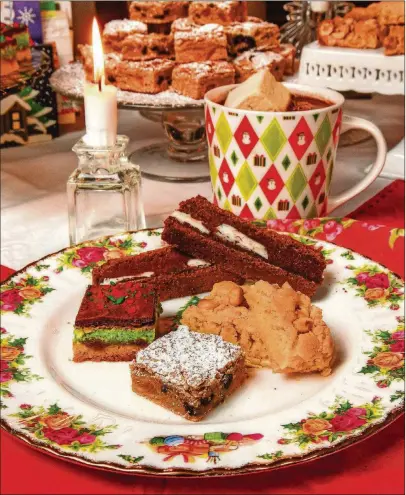  ?? STYLINGS BY CONNE WARD- CAMERON/ PHOTOS BY CHRIS HUNT FOR THE AJC ?? Clockwise starting at bottom of plate: California Fruit Bars, Viennese Marzipan Bars, Palm Beach Brownies and Brittle Peanut Bars.