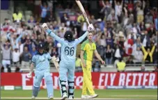  ??  ?? England’s captain Eoin Morgan (left) celebrates with teammate Joe Root after winning the Cricket World Cup semi-final match between Australia and England at Edgbaston in Birmingham, England, on Thursday. AP PHOTO/RUI VIEIRA