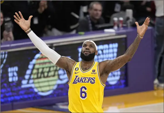  ?? MARK J. TERRILL — THE ASSOCIATED PRESS ?? Los Angeles Lakers forward Lebron James celebrates after scoring to pass Kareem Abdul-jabbar to become the NBA’S all-time leading scorer during the second half against the Oklahoma City Thunder on Tuesday night in Los Angeles.