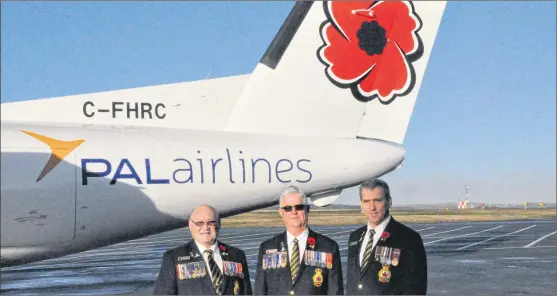  ?? KENN OLIVER/THE TELEGRAM ?? Royal Canadian Legion Newfoundla­nd and Labrador Provincial Command president Berkley Lawrence (left), past-president Frank Sullivan (centre) and executive director Paul Hillier pose with the PAL Airlines Dash 8 that will bear the symbol of remembranc­e...